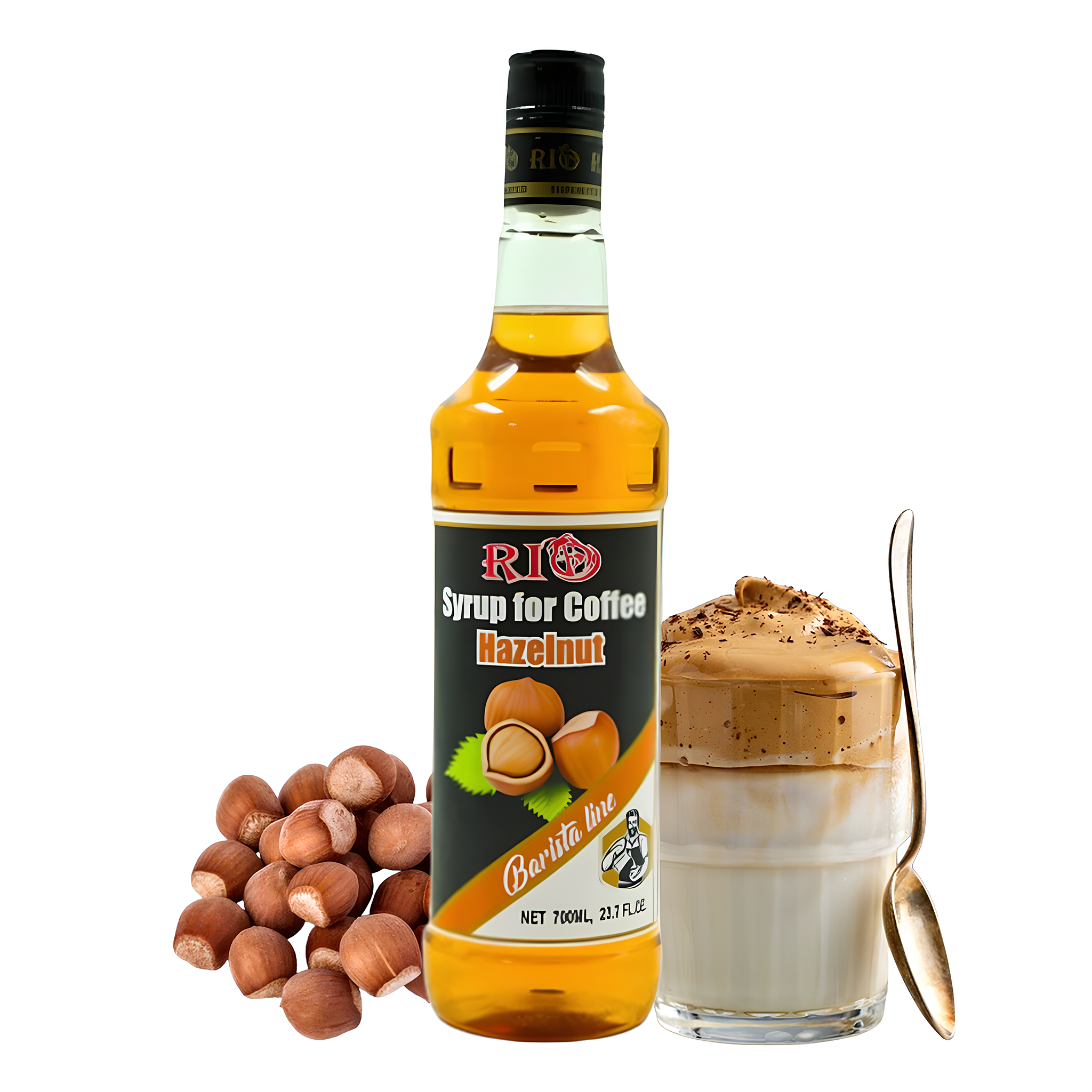 A bottle of Rio Hazelnut Syrup for Coffee is placed next to a bunch of hazelnuts, a glass of whipped coffee topped with coffee granules, and a spoon resting against the glass