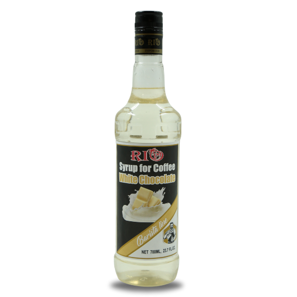 A 700ml bottle of Barista Aris brand white chocolate syrup for coffee. The bottle has a black label with an image of white chocolate squares and a coffee cup illustration. The text reads "Rio Syrup for Coffee White Chocolate Barista Line.